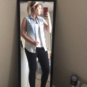 Sleeveless white washed denim top.